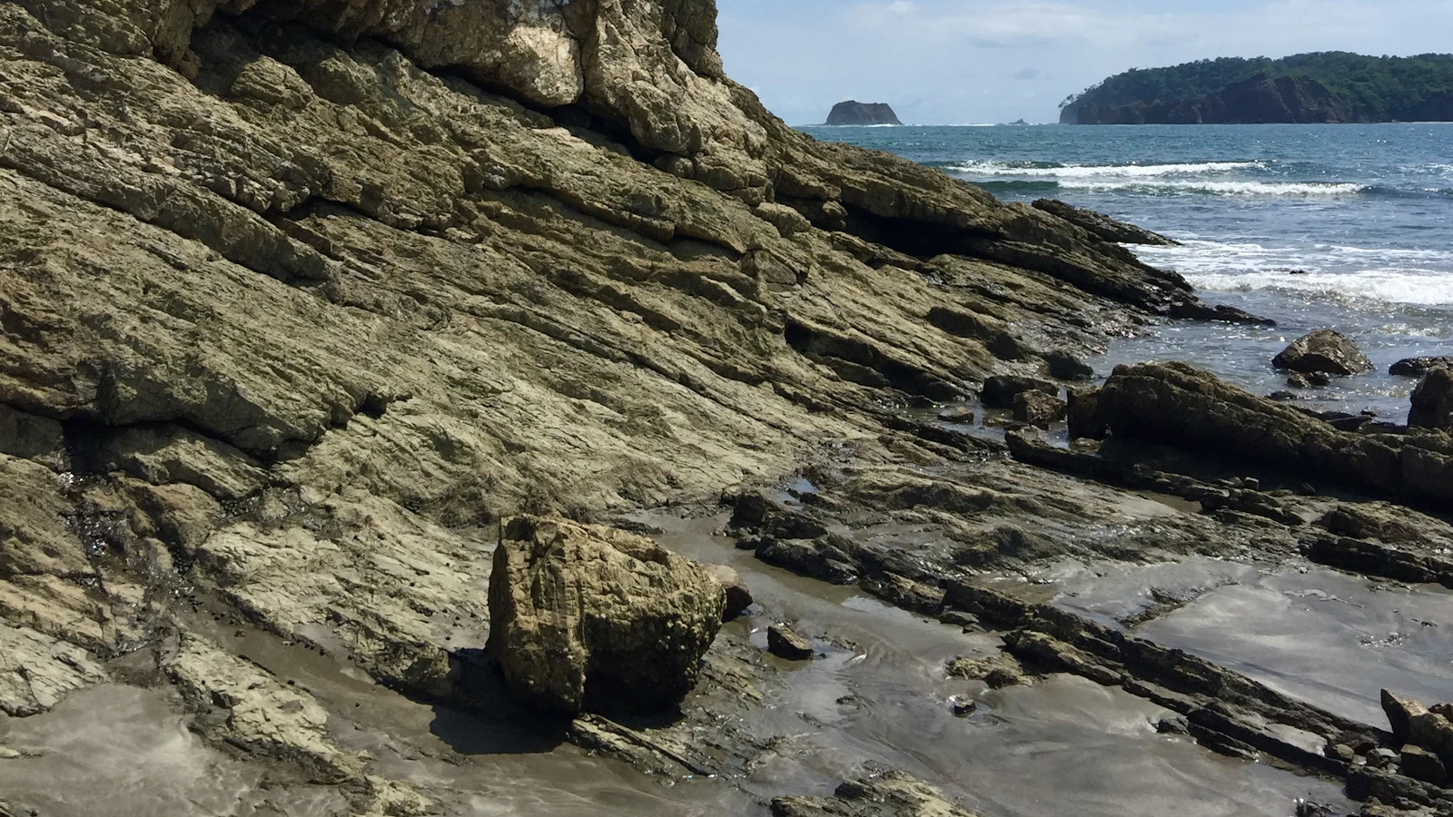 Dramatic volcanic coastal cliffs meeting the Pacific Ocean