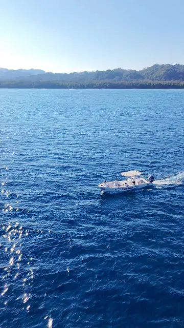 Ocean adventure in Cabuya, Costa Rica - Fishing boat on Pacific waters